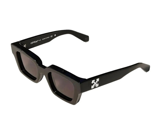 Black sunglasses with a distinctive logo on a white background