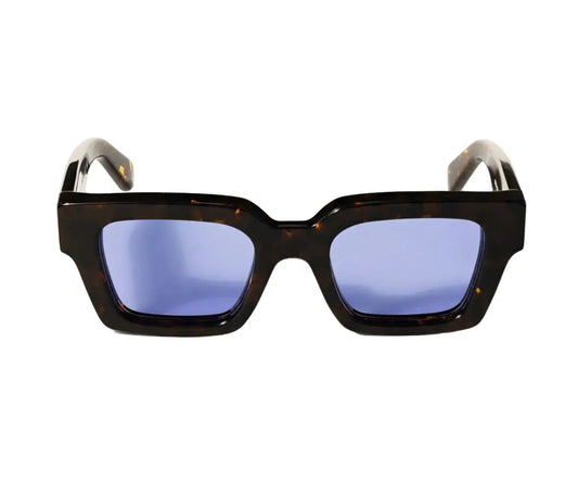 Sunglasses with a tortoiseshell frame and blue lenses on a white background