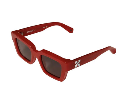 Red sunglasses with a brand logo on a white background