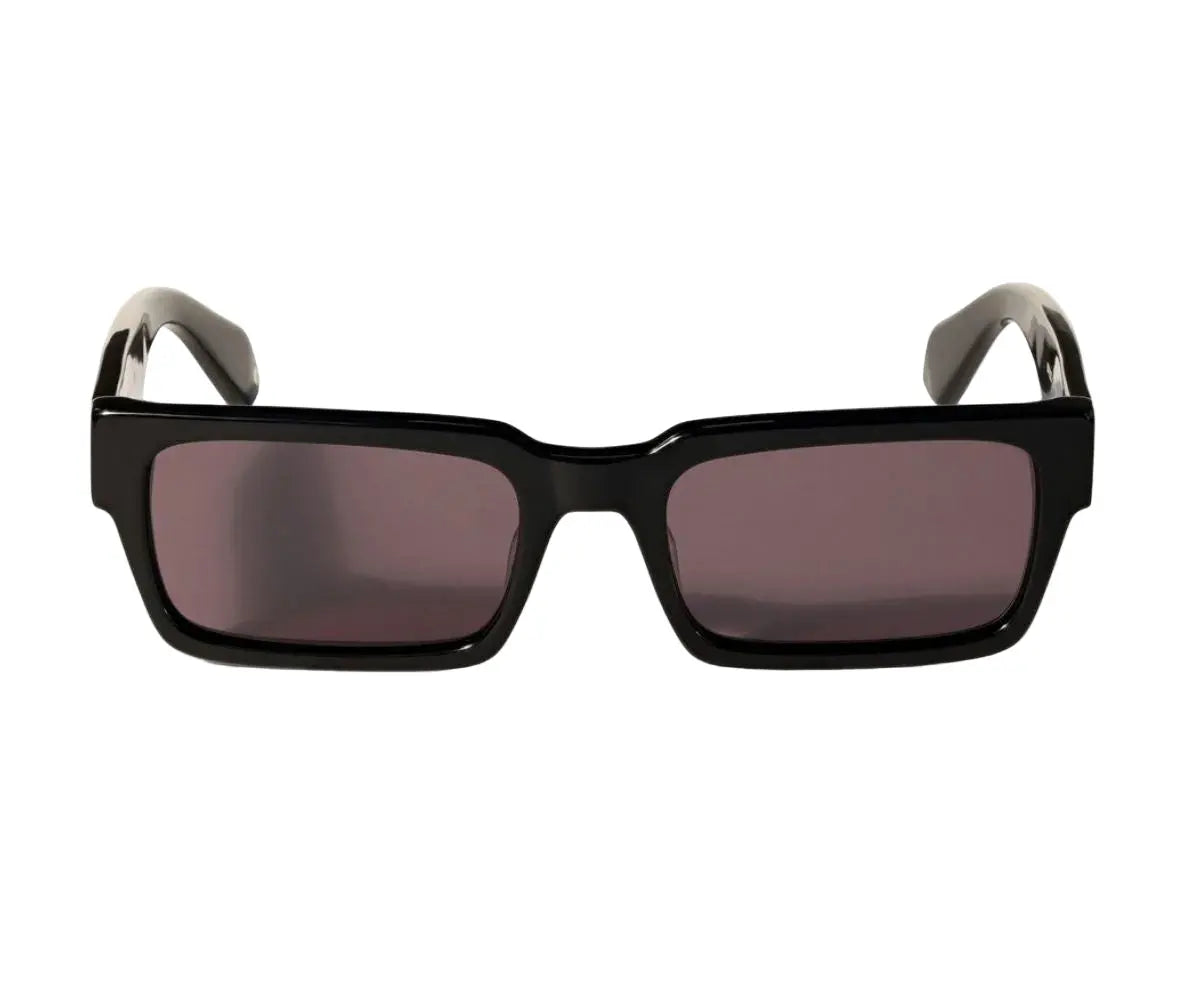 Black sunglasses with dark lenses on a white background