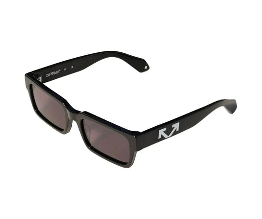 Sunglasses with tortoiseshell frame and blue lenses on a white background
