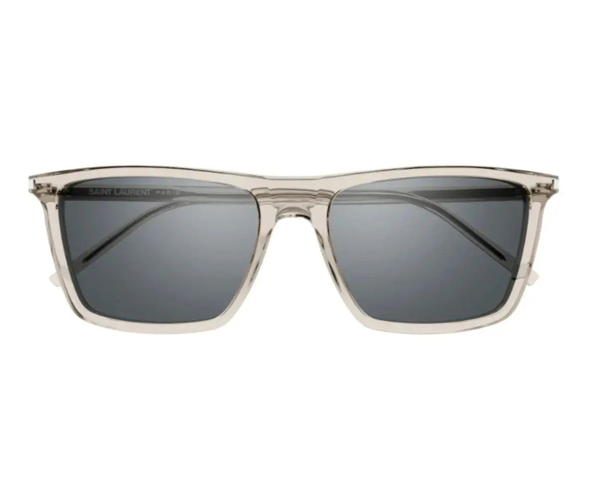 Sunglasses with clear frame and dark lenses on a white background