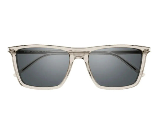 Sunglasses with clear frame and dark lenses on a white background