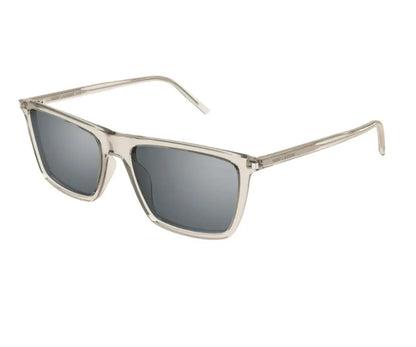 Sunglasses with gold frame and dark lenses on a white background