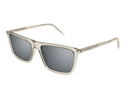 Sunglasses with gold frame and dark lenses on a white background