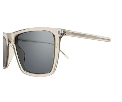 Sunglasses with a clear frame and dark lenses on a white background