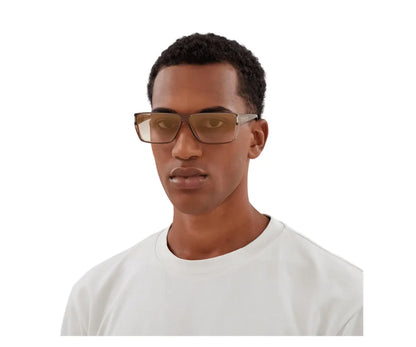 Man wearing glasses and a white shirt on a white background