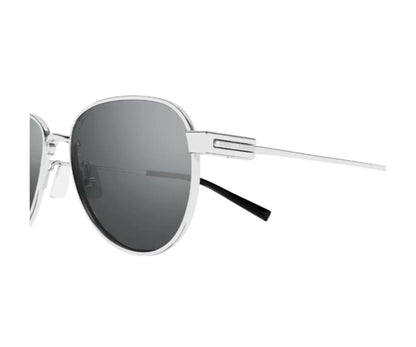 Sunglasses with silver frame and dark lenses on a white background