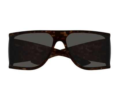 Sunglasses with tortoiseshell frame and dark lenses on a white background