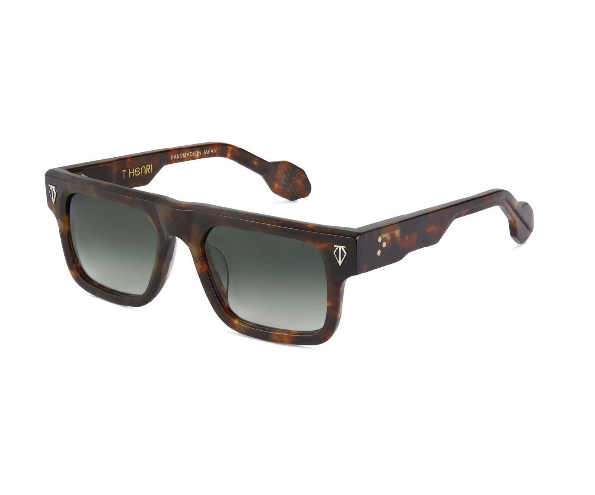 Sunglasses with tortoiseshell frame and gradient lenses on a white background