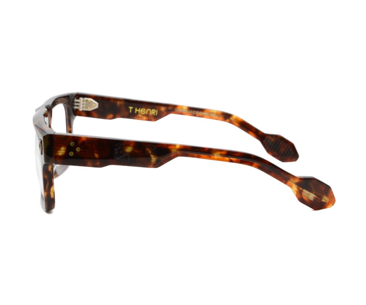 Tortoiseshell glasses with 'THOM' branding on a white background