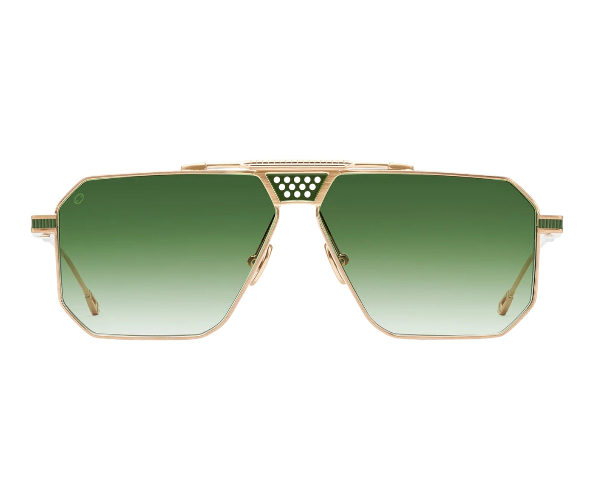 Sunglasses with gold frame and green gradient lenses on a white background