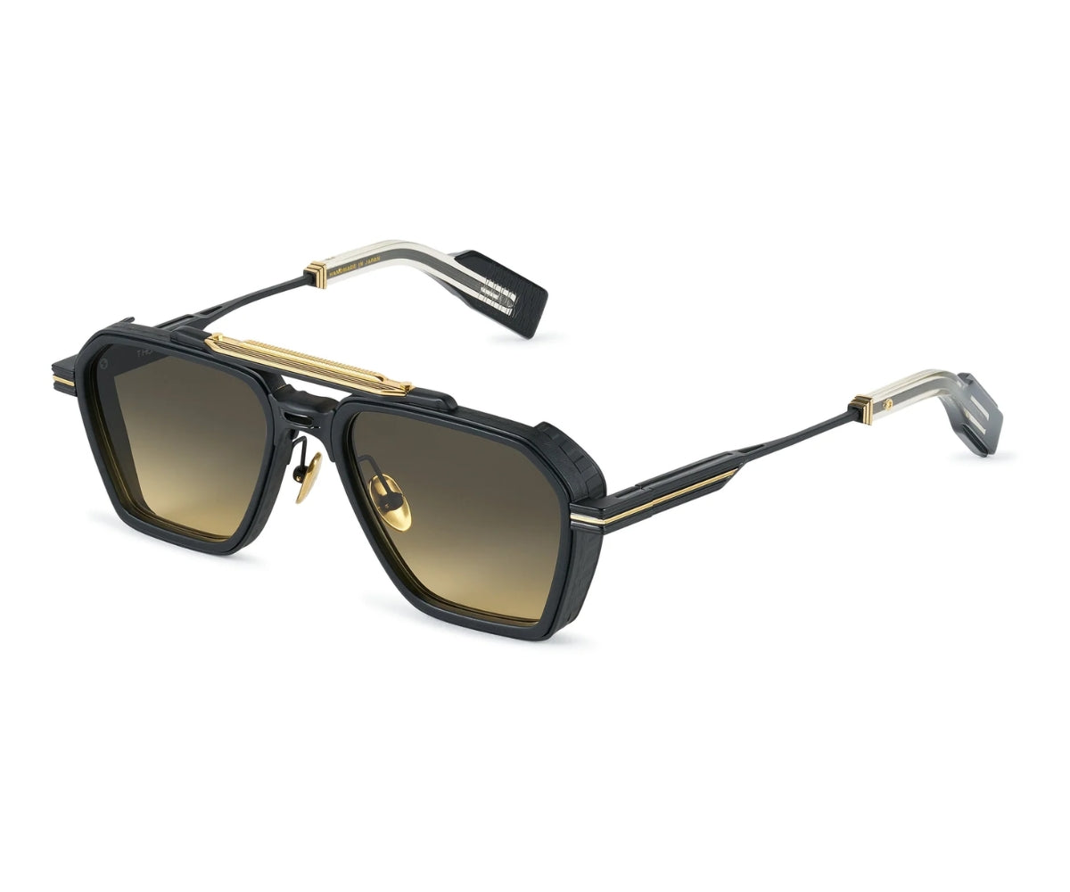 Sunglasses with black frame and gold accents on a white background