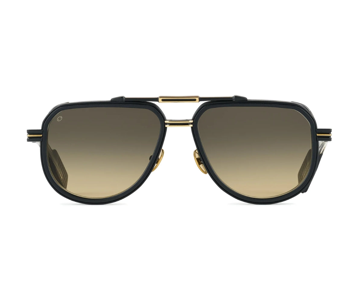 Sunglasses with gold frame and black lenses on a white background