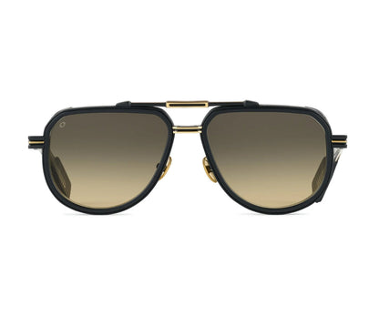 Sunglasses with gold frame and black lenses on a white background