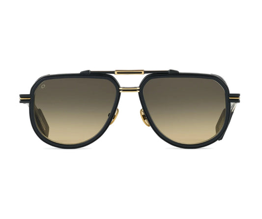 Sunglasses with gold frame and black lenses on a white background