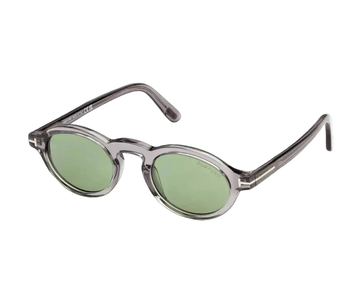 Sunglasses with green lenses and clear frame on a white background
