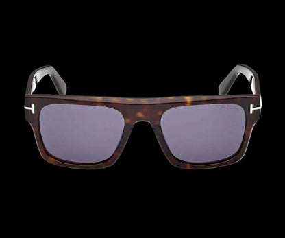 Sunglasses with tortoiseshell frame and dark lenses on a white background