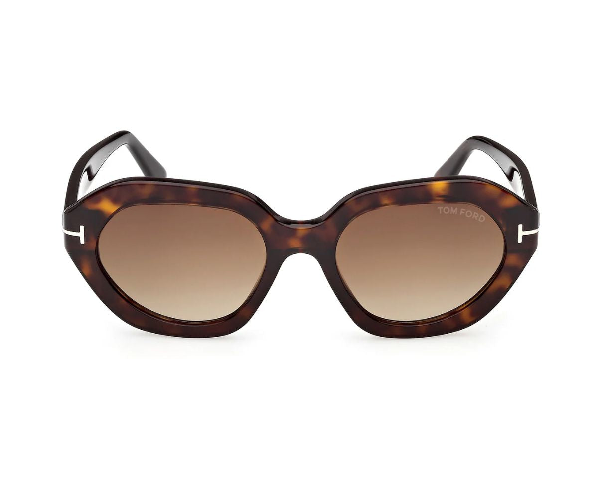 Tortoiseshell sunglasses with brown lenses on a white background