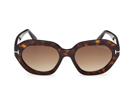 Tortoiseshell sunglasses with brown lenses on a white background