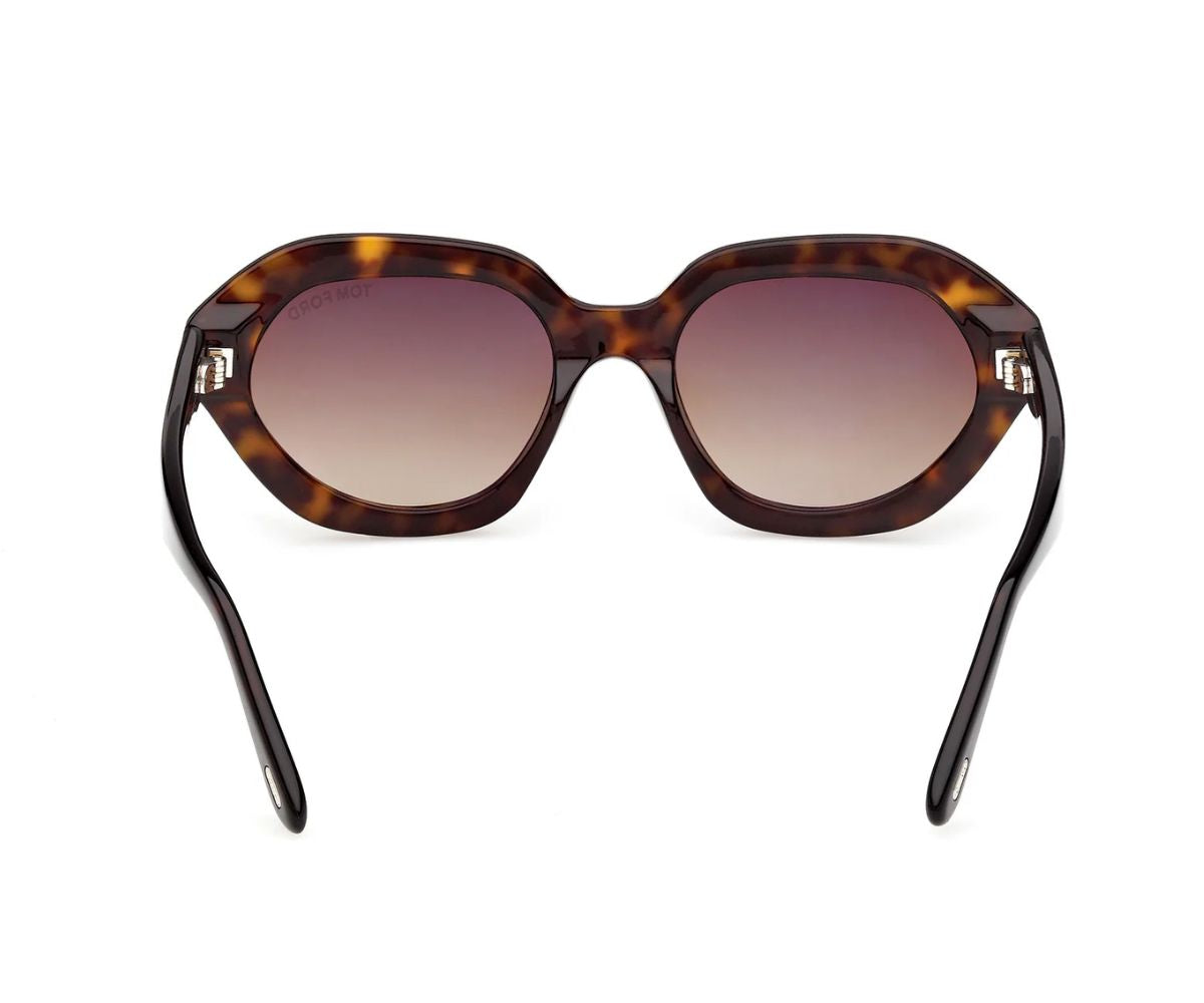 Sunglasses with tortoiseshell frame and gradient lenses on a white background