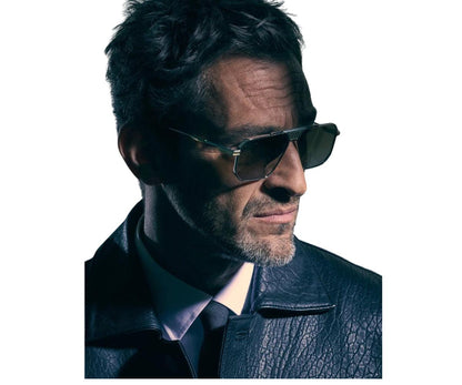 Man wearing sunglasses and a leather jacket on a white background