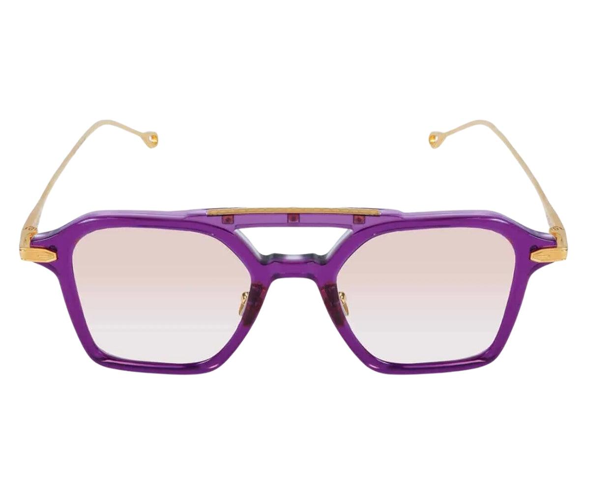 Purple sunglasses with gold accents on a white background
