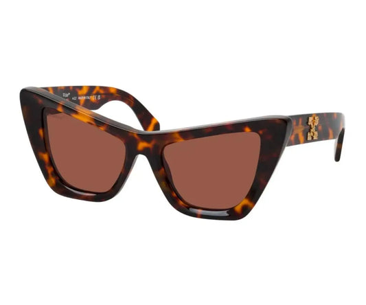 Cat-eye sunglasses with tortoiseshell frame and brown lenses on a white background