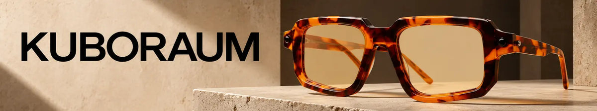 Kuboraum P23 Sun BTO 51 brown tortoise sunglasses with Kuboraum branding on a premium architectural background