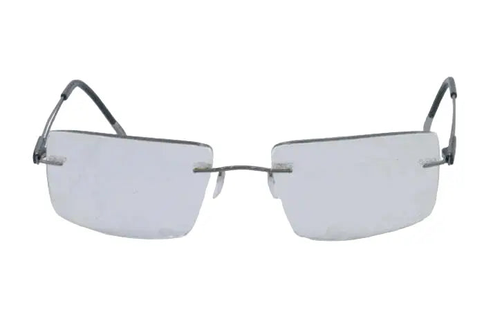 Pair of rimless eyeglasses on a light gray background