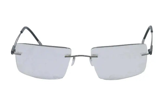 Pair of rimless eyeglasses on a light gray background