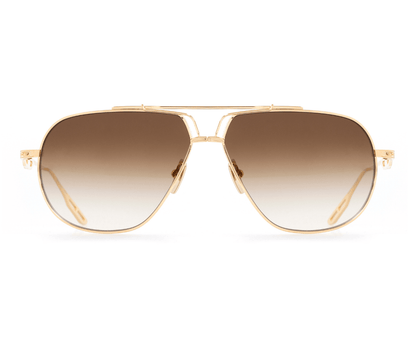Gold-framed sunglasses with brown gradient lenses on a white background