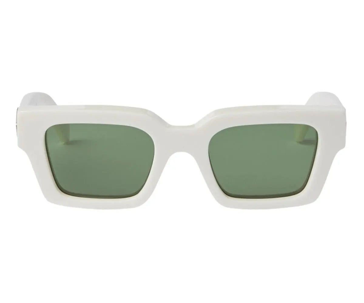 White sunglasses with green lenses on a white background